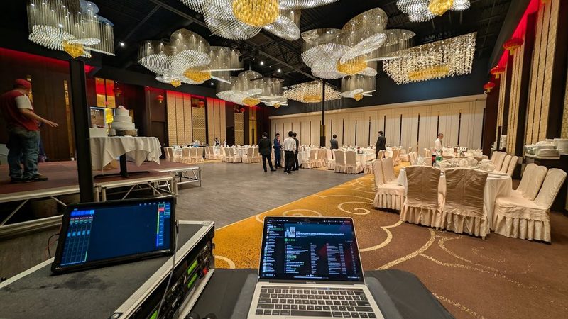 DJ booth facing a ballroom reception