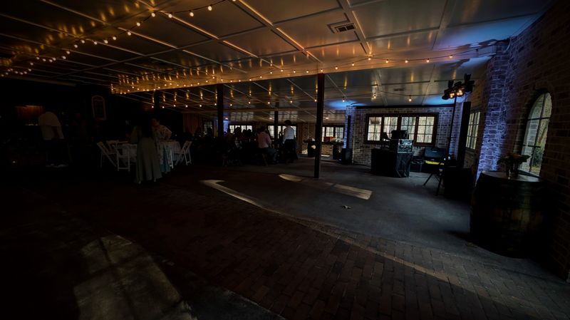 Rustic brick venue with string lights